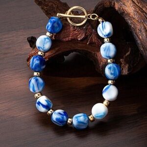 Blue and White Beaded Bracelet with Gold Accents